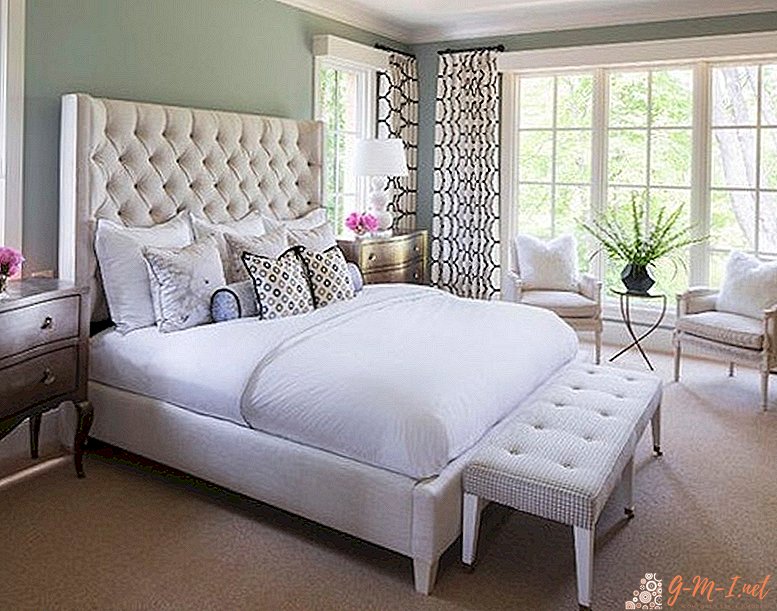 White bed in the bedroom interior with photo
