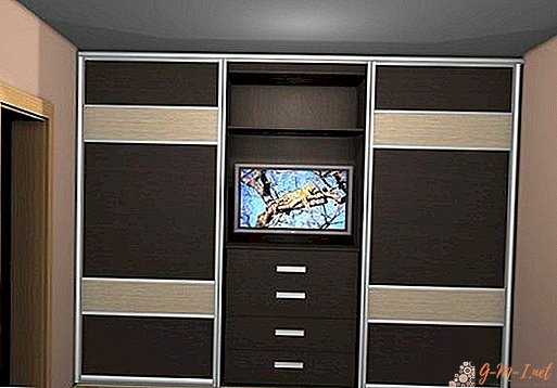 Sliding wardrobe with a TV in the middle