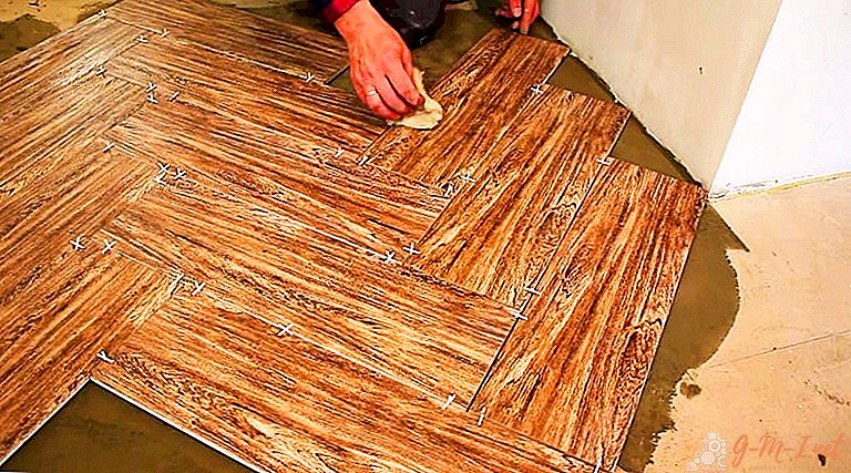 Laying tiles on the floor with herringbone